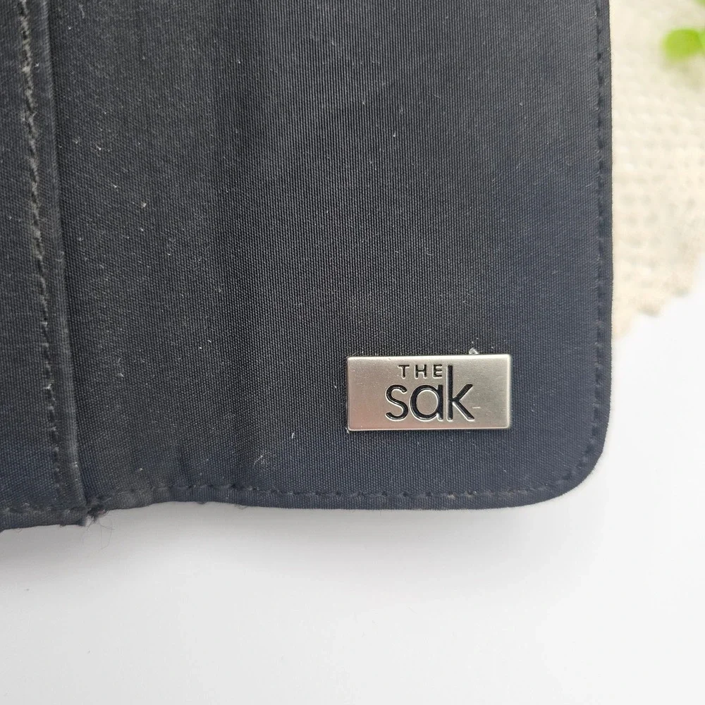 The Sak Black Woven Raffia Clutch Wallet Organizer Snap Closure